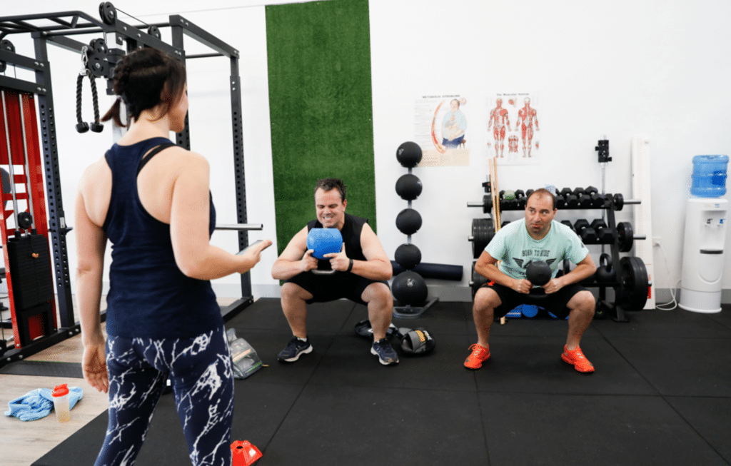 men in fitness class with trainer