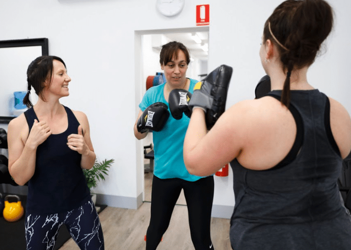 women in a boxing class