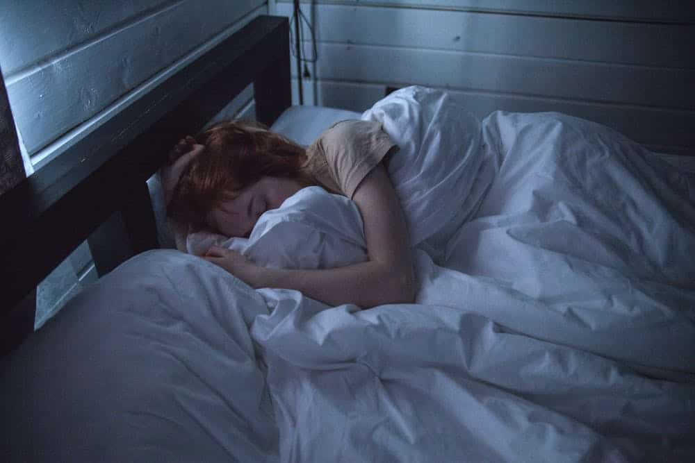 woman sleeping in bed 