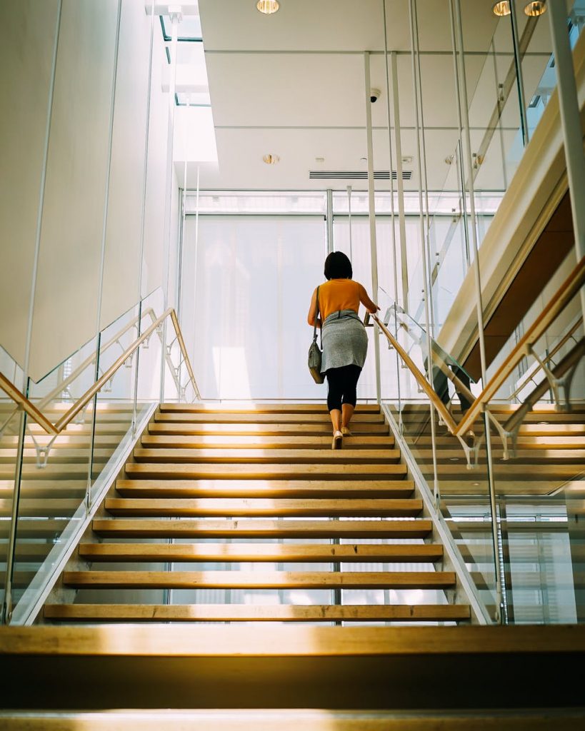 woman walking up the stairs