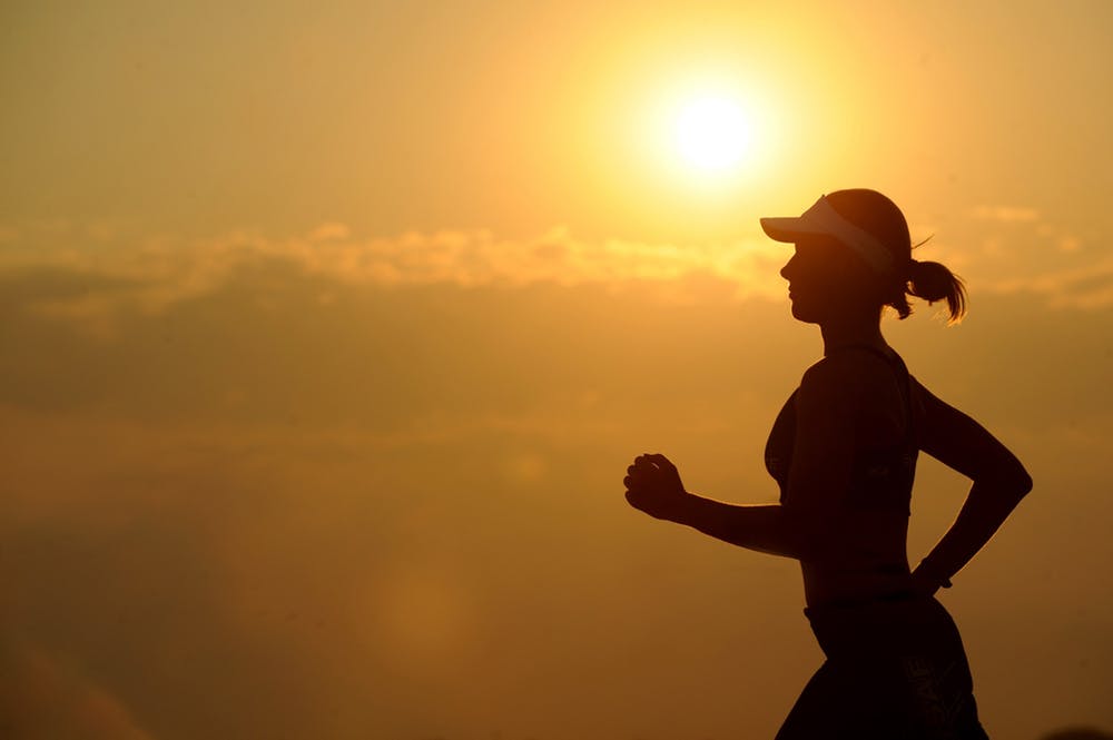 woman running in sunrise 