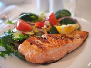 salmon with a salad on a plate