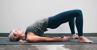 woman doing glute bridges 