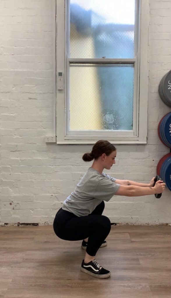 Woman does Counter Balance Squat