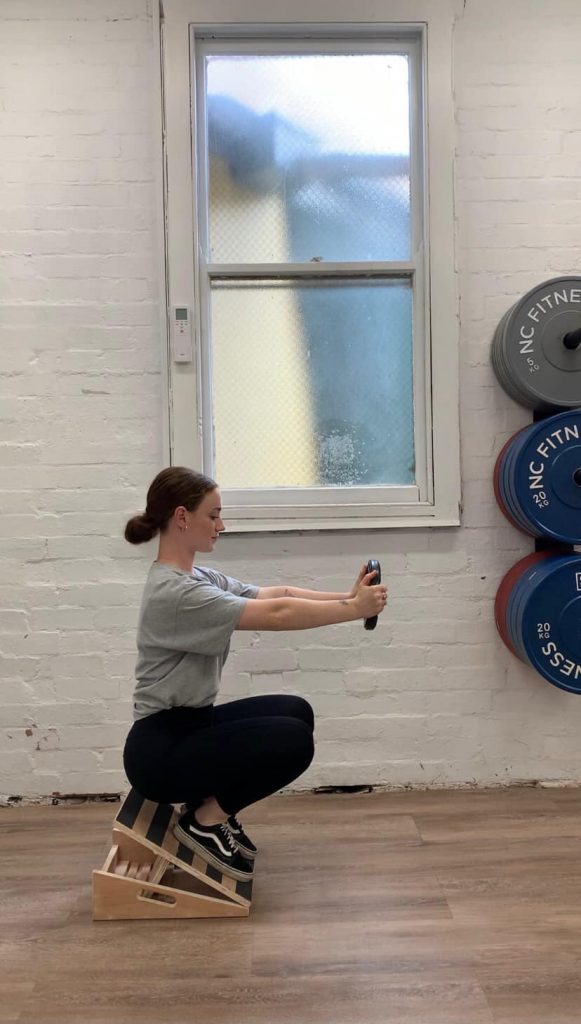 Woman does Counter Balance Squat