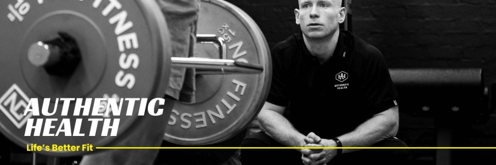 Black and white banner of an Authentic Health trainer watching a barbell lift, with the tagline Life's Better Fit.